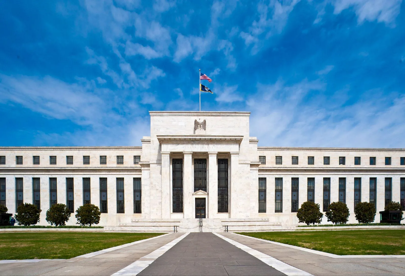 The Federal Reserve's Marriner S. Eccles Building in Washington, D.C., under a blue sky.
